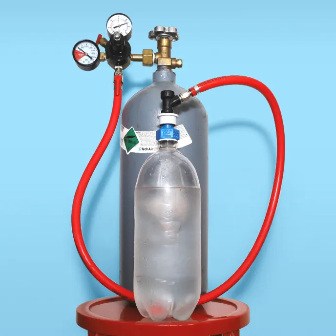 Home carbonation system setup with CO2 tank and water bottle
